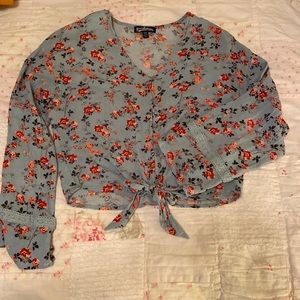 Cute, cropped, blue floral blouse. Size XS.